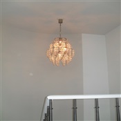 Fixture with hanging glasses installed over stairwell, New Jersey.